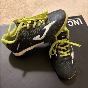 Kids Black and Green soccer shoes